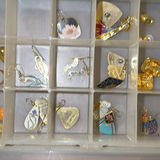 Assorted jewelry collection: earrings, bracelets, brooches, and pendants - thumbnail 8 of 13