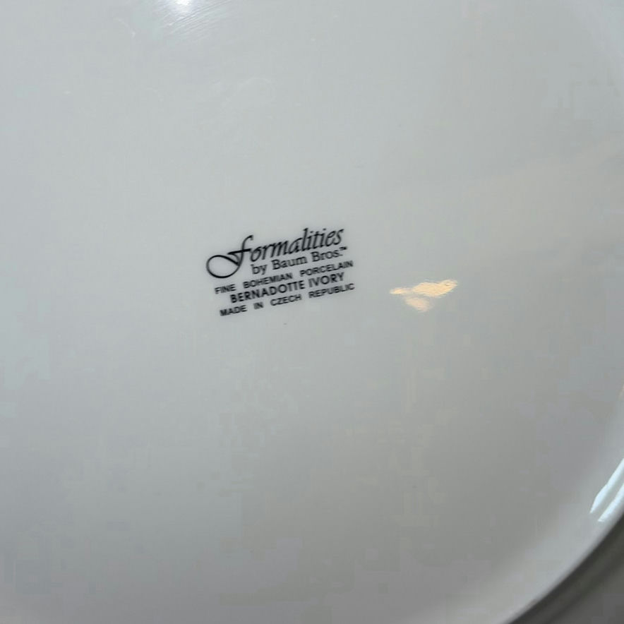Porcelain dinnerware set with gold-edged plates, bowls, saucers, and cups - image 3 of 9