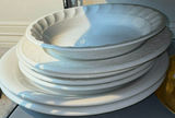 Stacked white ceramic plates with glass and crystal serving dishes - thumbnail 2 of 6