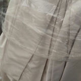 Wedding dress and assorted clothing on a garment rack - thumbnail 11 of 15