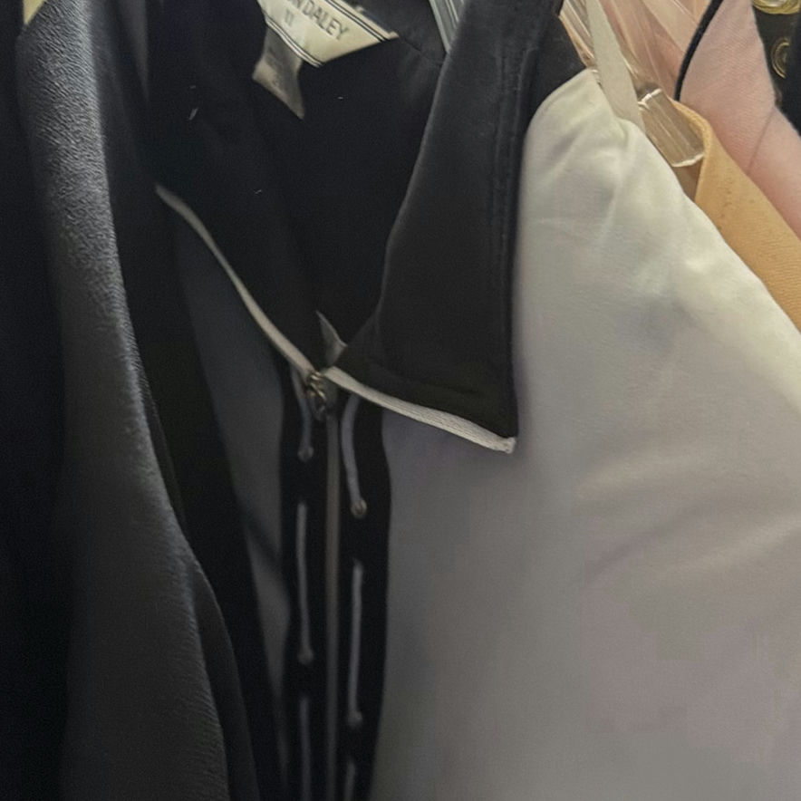 Wedding dress and assorted clothing on a garment rack - image 14 of 15
