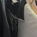 Wedding dress and assorted clothing on a garment rack - thumbnail 14 of 15