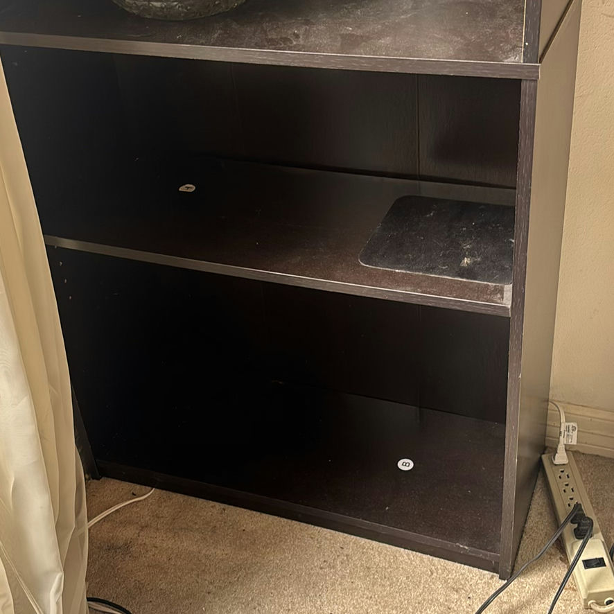 Tall black bookshelf with glassware - image 2 of 3