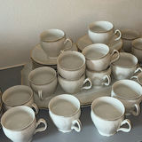 Porcelain dinnerware set with gold-edged plates, bowls, saucers, and cups - thumbnail 8 of 9