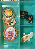 Assorted jewelry collection: earrings, bracelets, brooches, and pendants - thumbnail 10 of 13
