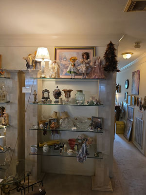 Vintage glassware and porcelain figurine collection on glass shelves - Image 1 of 5