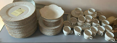 Porcelain dinnerware set with gold-edged plates, bowls, saucers, and cups - Image 1 of 9