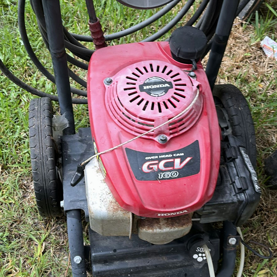 Red Black Max pressure washer with Honda engine and two red gasoline cans - image 2 of 6