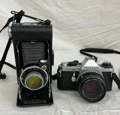 Two vintage film cameras: Kodak Vigilant Junior Six-20 folding camera and Pentax ME Super 35mm SLR - Image 1 of 6
