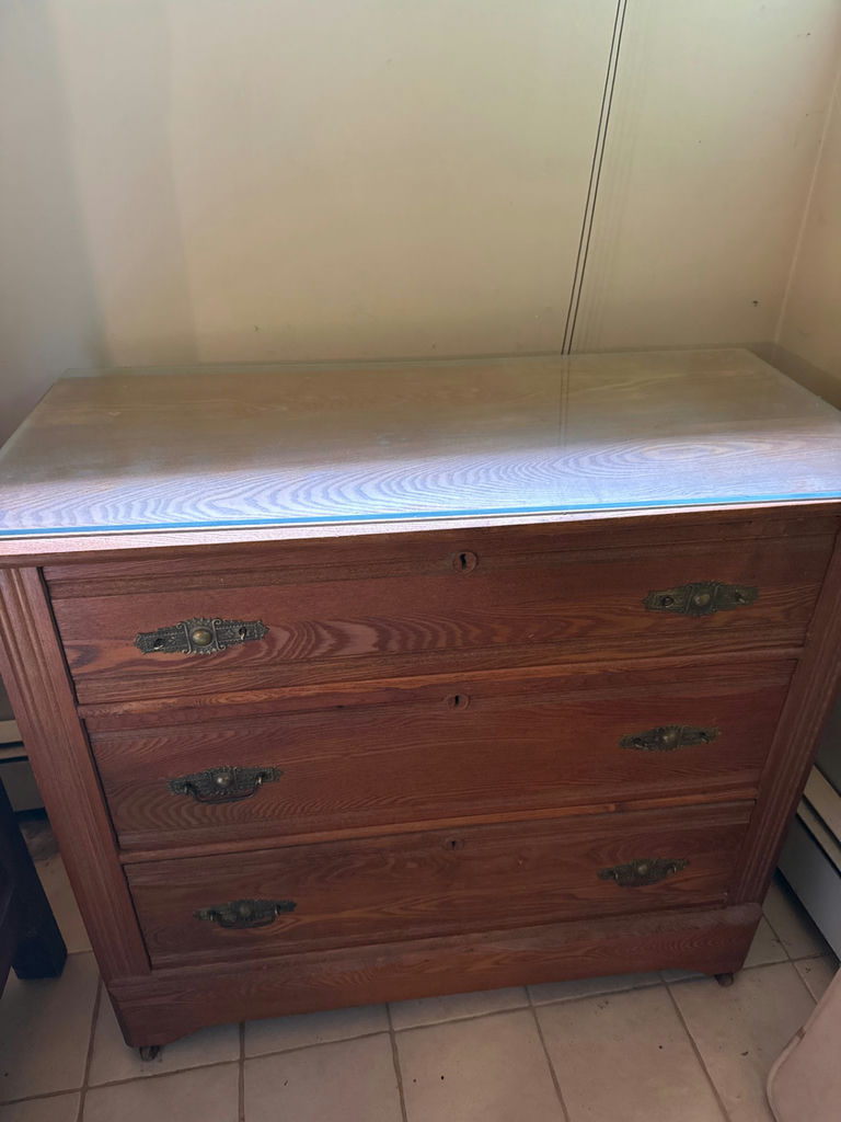 Wooden dresser with glass top and three drawers - image 1 of 3