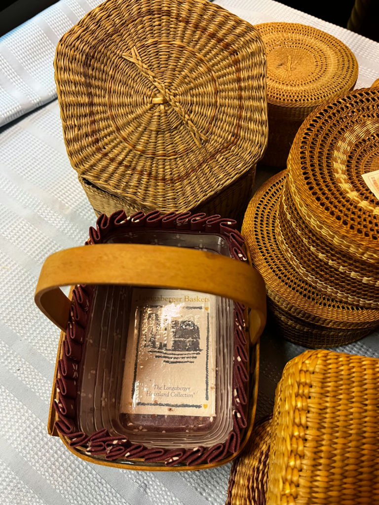 An assortment of small woven baskets and a small Longaberger handled basket - image 2 of 3