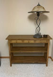 Wooden Console Table with Three Drawers, Shelves, and a Metal Table Lamp - thumbnail 1 of 7