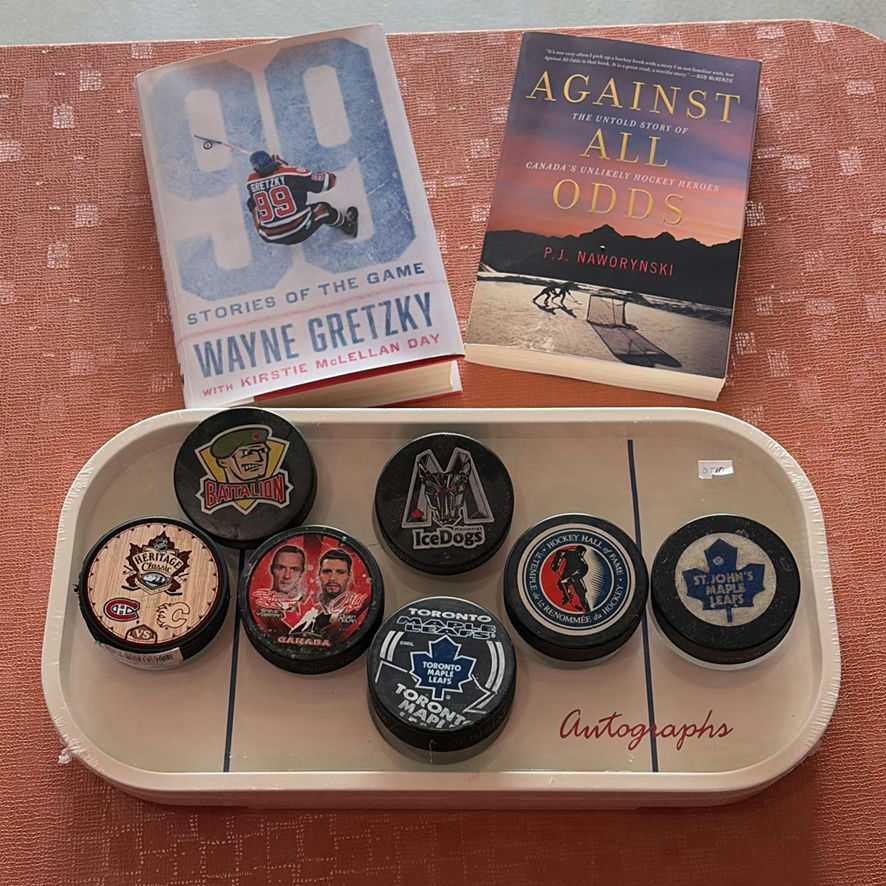 Hockey Pucks And Hockey Books - image 1 of 10
