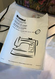 Kenmore sewing machine with manual, power adapter, and floral carrying bag - thumbnail 2 of 7