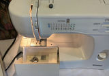 Kenmore sewing machine with manual, power adapter, and floral carrying bag - thumbnail 5 of 7