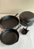Cast iron cookware set with Lodge skillets, Lodge Dutch oven, and Griswold ash tray - thumbnail 1 of 9
