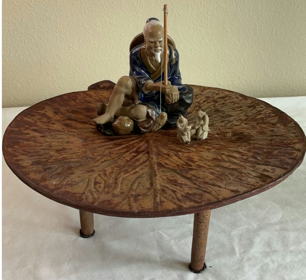 Cast Iron Leaf Stand And Small Asian Figurines - image 1 of 7