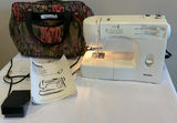 Kenmore sewing machine with manual, power adapter, and floral carrying bag - thumbnail 1 of 7