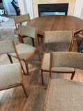 Round wooden dining table with upholstered chairs - thumbnail 1 of 8