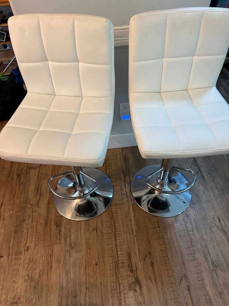Two white tufted bar stools with chrome pedestal bases - image 1 of 3