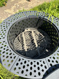 Round gray metal firepit with perforated edge and inner grate - thumbnail 3 of 3