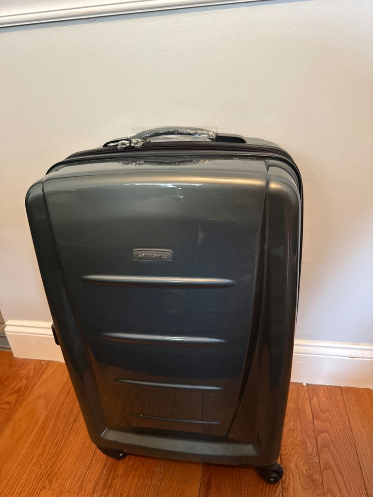 Gray Samsonite hard-shell rolling suitcase with TSA lock - image 1 of 4
