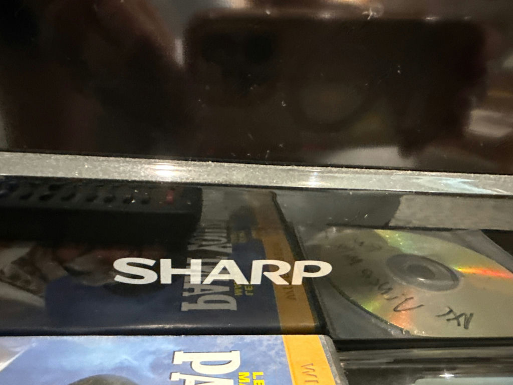 Sharp AQUOS flat-screen TV with remotes and media discs - image 3 of 4
