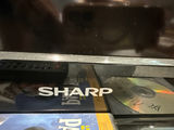 Sharp AQUOS flat-screen TV with remotes and media discs - thumbnail 3 of 4
