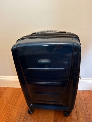 Blue Samsonite hard-shell rolling suitcase - Image 1 of 5