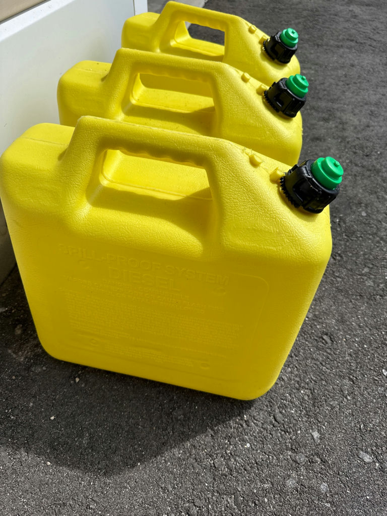 Three yellow 5-gallon diesel fuel containers - image 2 of 2