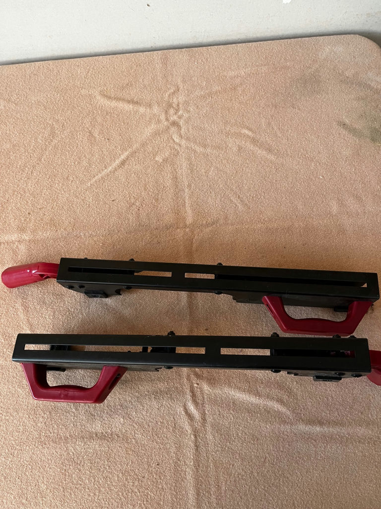 Pair of black plastic bar clamps with red handles - image 3 of 3