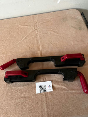 Pair of black plastic bar clamps with red handles - Image 1 of 3