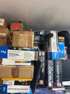 Stack of computer motherboard and PC hardware in  boxes - Image 1 of 2