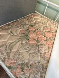 White metal trundle  bed frame with upholstered headboard, white quilt, and floral-pattern mattress - thumbnail 5 of 5