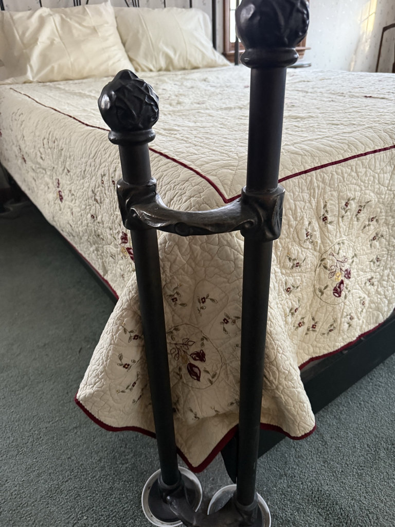 Wrought iron bed with quilted bedding - image 2 of 7