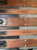 Antique wooden steamer trunk with embossed metal panels - thumbnail 2 of 7