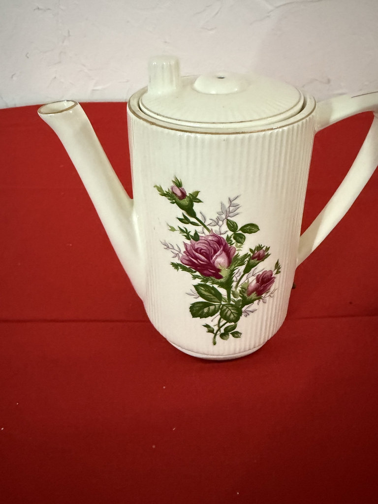 Vintage ceramic teapot and face-shaped decorative planter - image 2 of 10