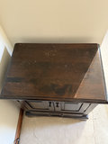 Dark wooden cabinet with double doors and bottom drawer - thumbnail 3 of 6