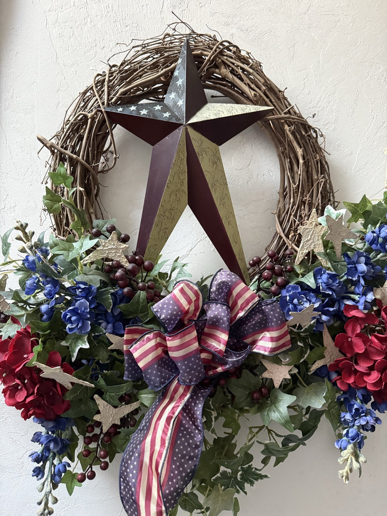 Patriotic wreath with star centerpiece and floral accents - image 2 of 3
