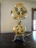 Floral ceramic table lamp with ornate metal base - thumbnail 1 of 4