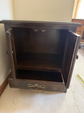 Dark wooden cabinet with double doors and bottom drawer - thumbnail 2 of 6