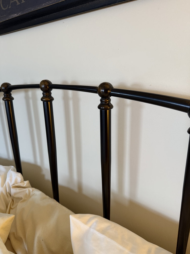 Metal bed frame with quilted floral quilt and bedside tables - image 4 of 6