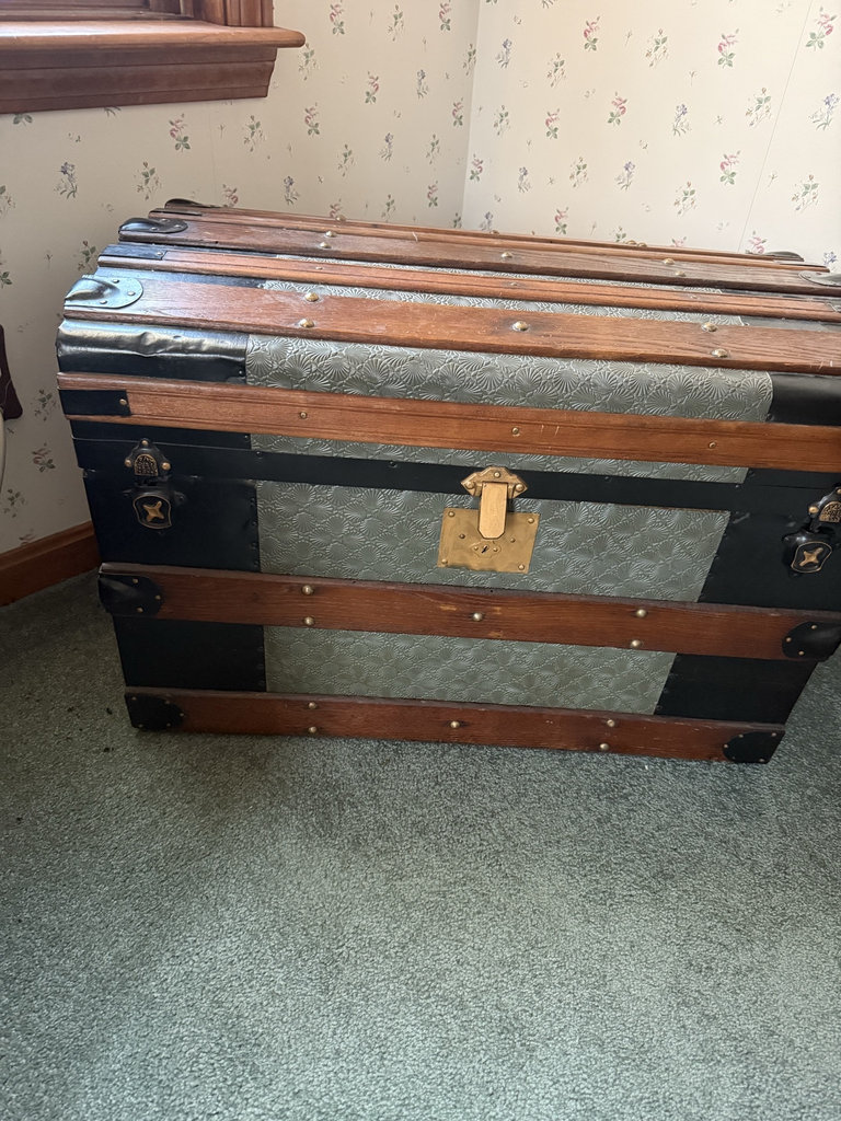 Antique wooden steamer trunk with embossed metal panels - image 1 of 7