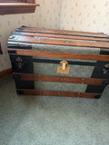 Antique wooden steamer trunk with embossed metal panels - thumbnail 1 of 7