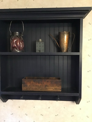 Navy blue wall-mounted shelf with vintage copper pitcher, red lantern, and wooden cheese box - Image 1 of 4