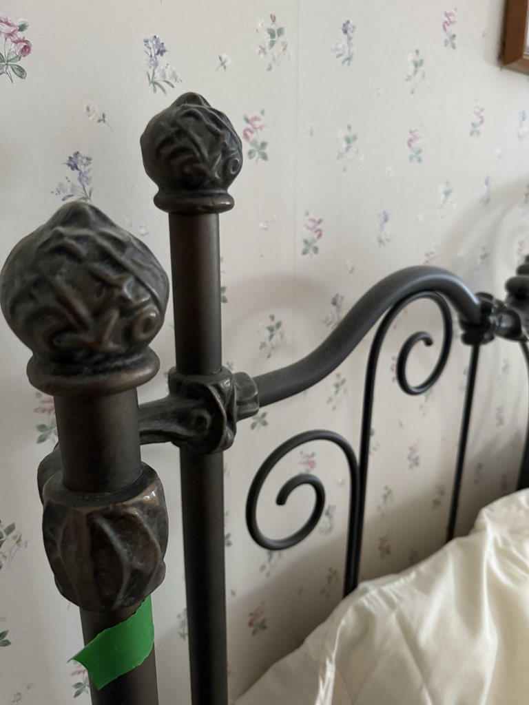 Wrought iron bed with quilted bedding - image 4 of 7
