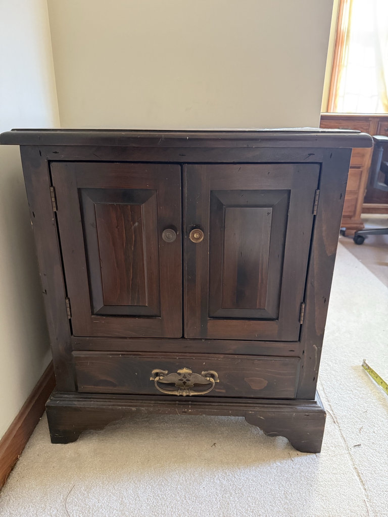 Dark wooden cabinet with double doors and bottom drawer - image 1 of 6