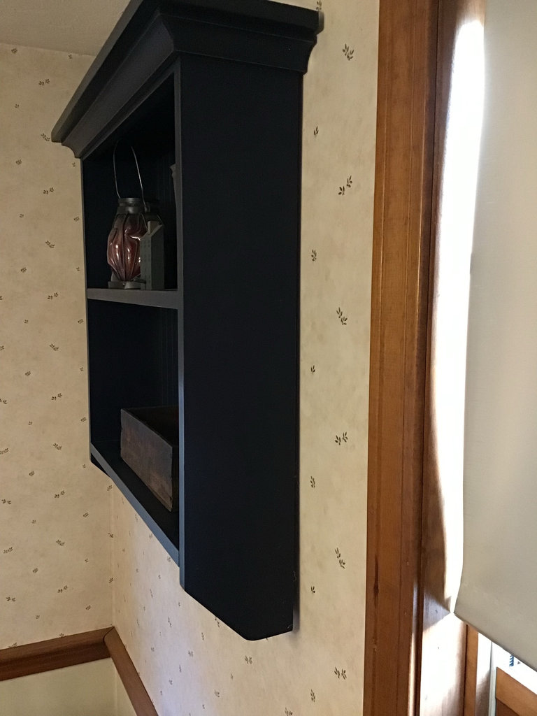 Navy blue wall-mounted shelf with vintage copper pitcher, red lantern, and wooden cheese box - image 2 of 4