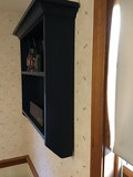 Navy blue wall-mounted shelf with vintage copper pitcher, red lantern, and wooden cheese box - thumbnail 2 of 4