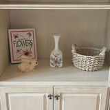 Flower Book, Ceramic Rabbit Figurine, Floral Vase, and Wicker Basket - thumbnail 1 of 4
